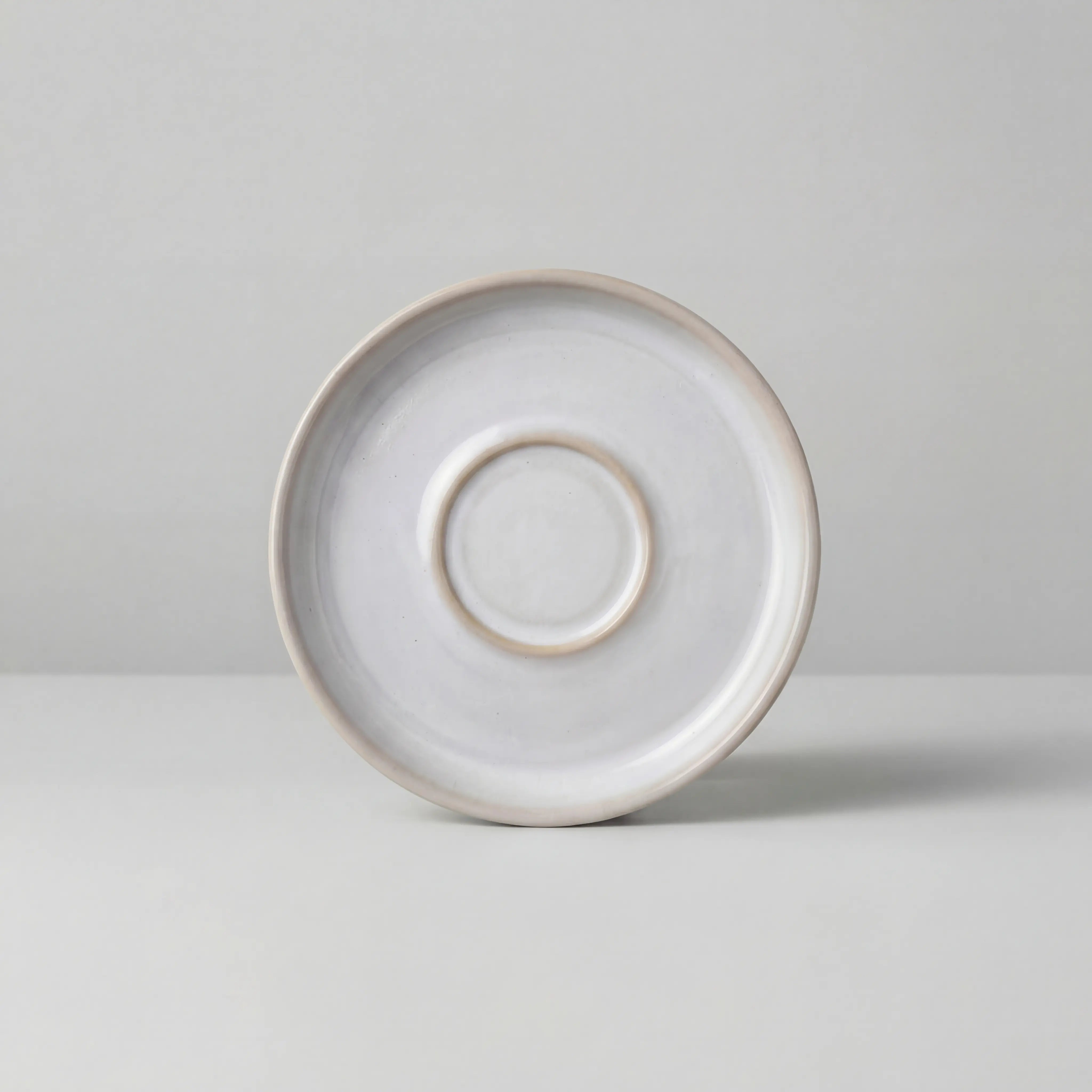 Lyra white espresso saucer viewed from above