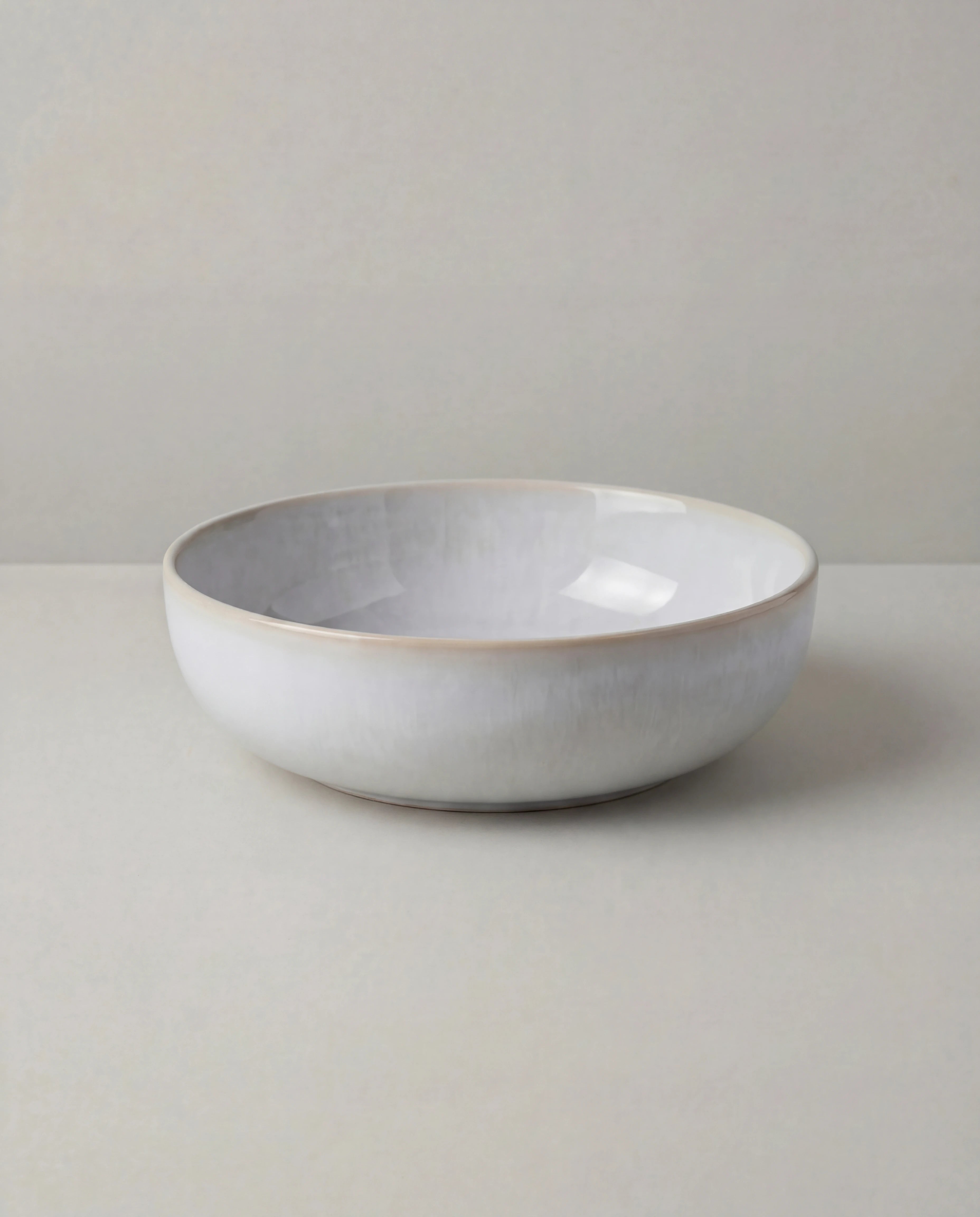 Lyra white ceramic dish set with a bowl resting on a matching plate