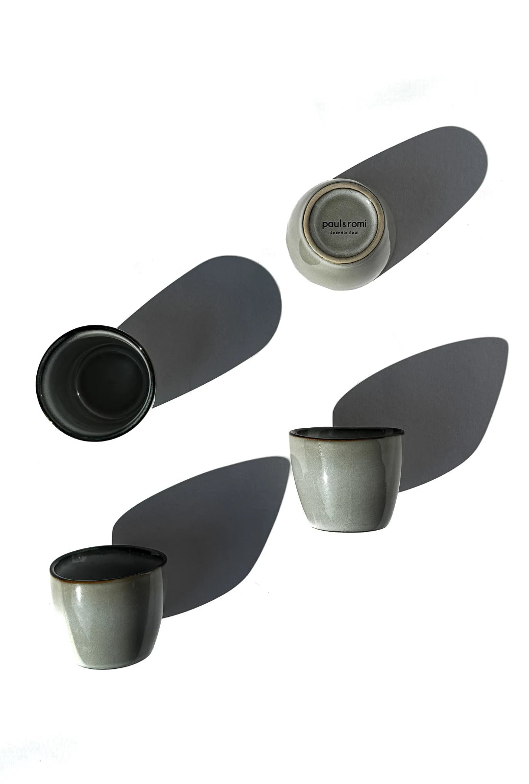 Top view collage of Scandic Soul Nordic Forest dip espresso cups with gray exteriors and dark interiors