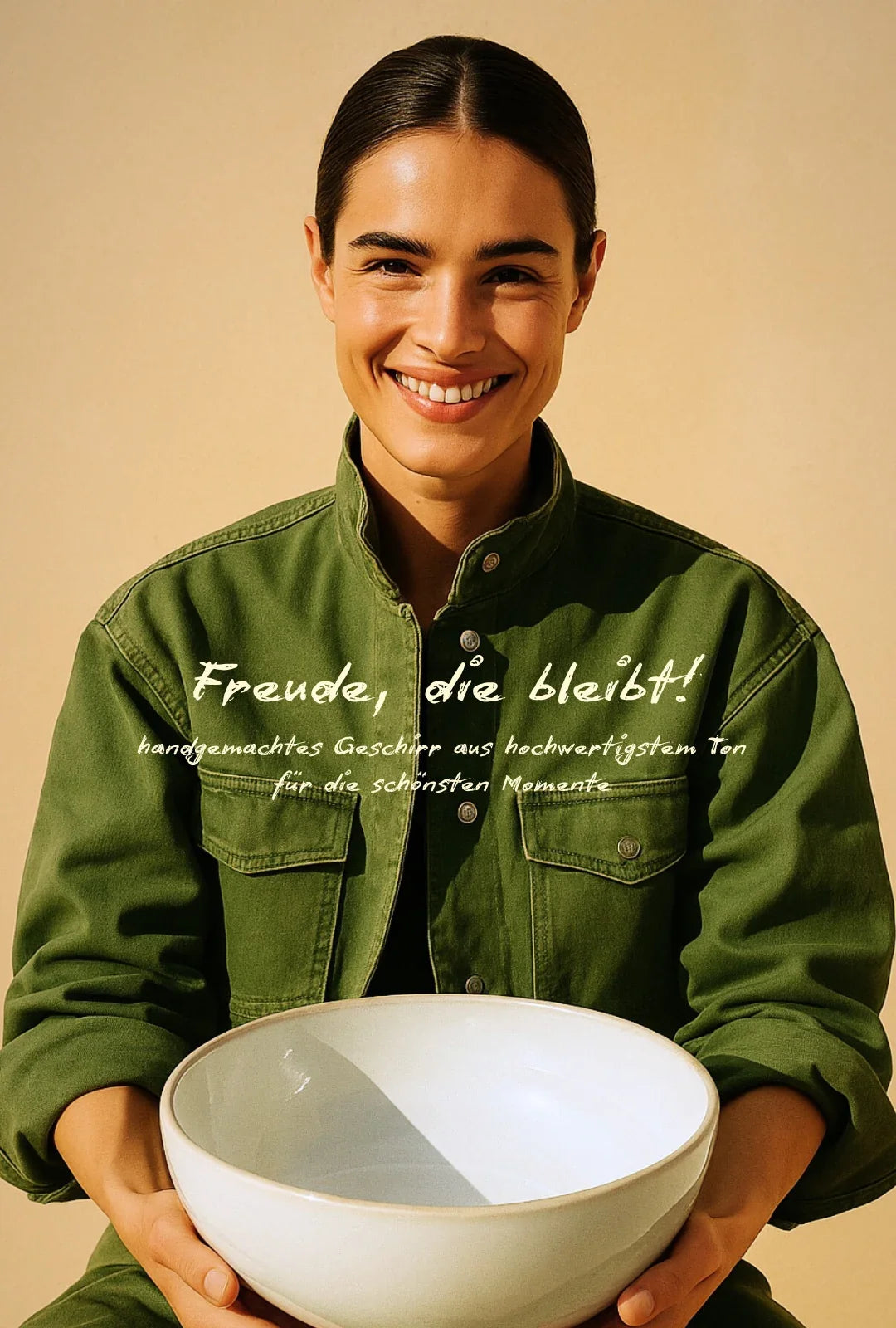 Smiling woman in a green jacket holding a large white ceramic bowl for Boa Noite 20 piece dinnerware