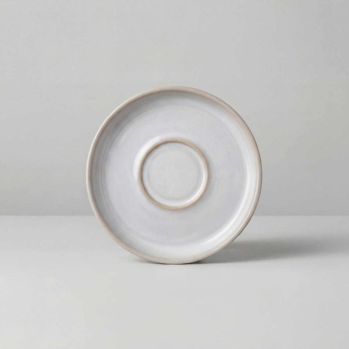Lyra white espresso saucer viewed from above