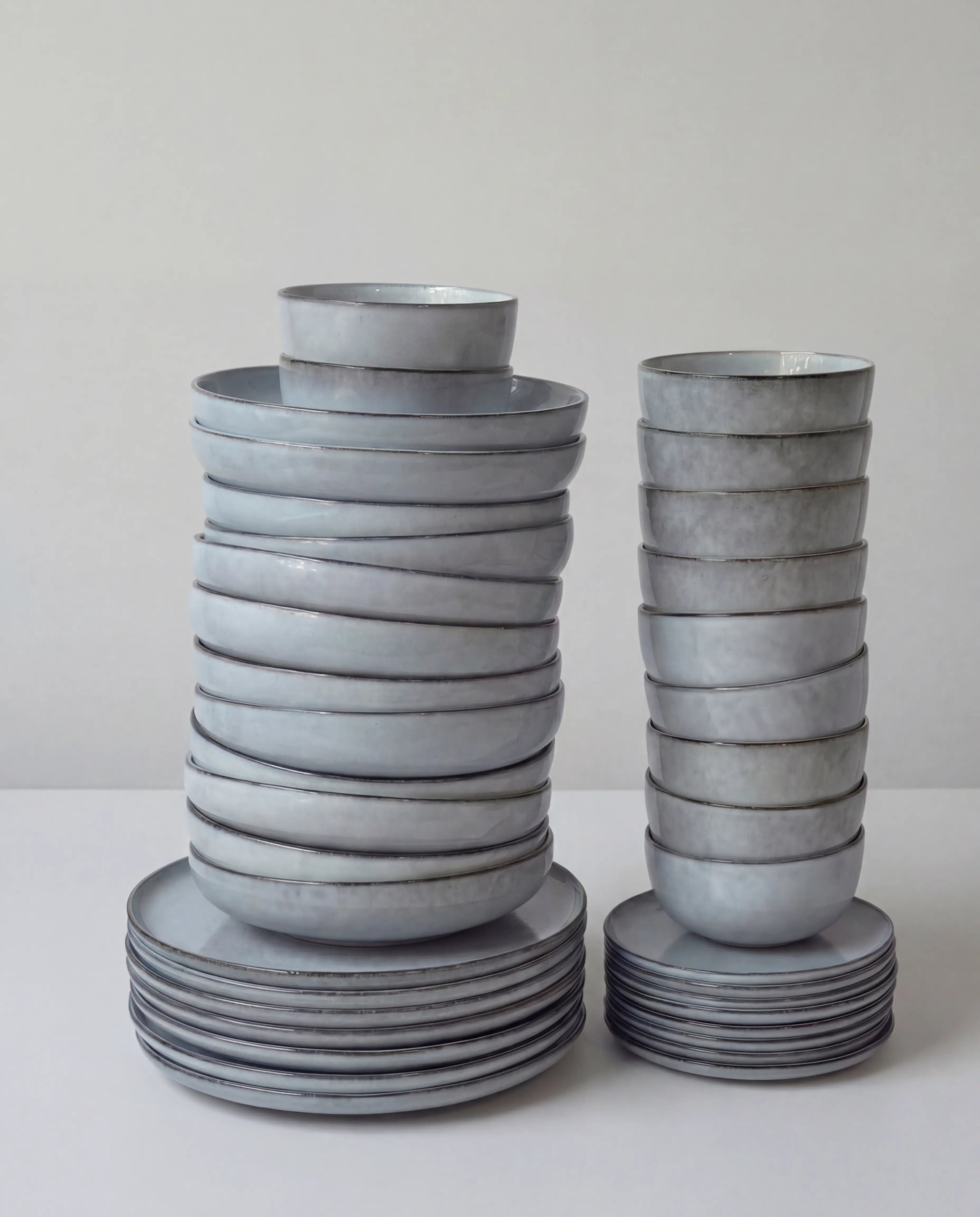Stacked gray glazed bowls from Scandic Soul Nordic Fjord 48 piece dinnerware set