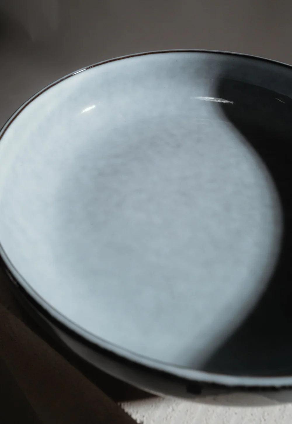 Close-up of Nordic Fjord bowl with pale blue interior and dark rim