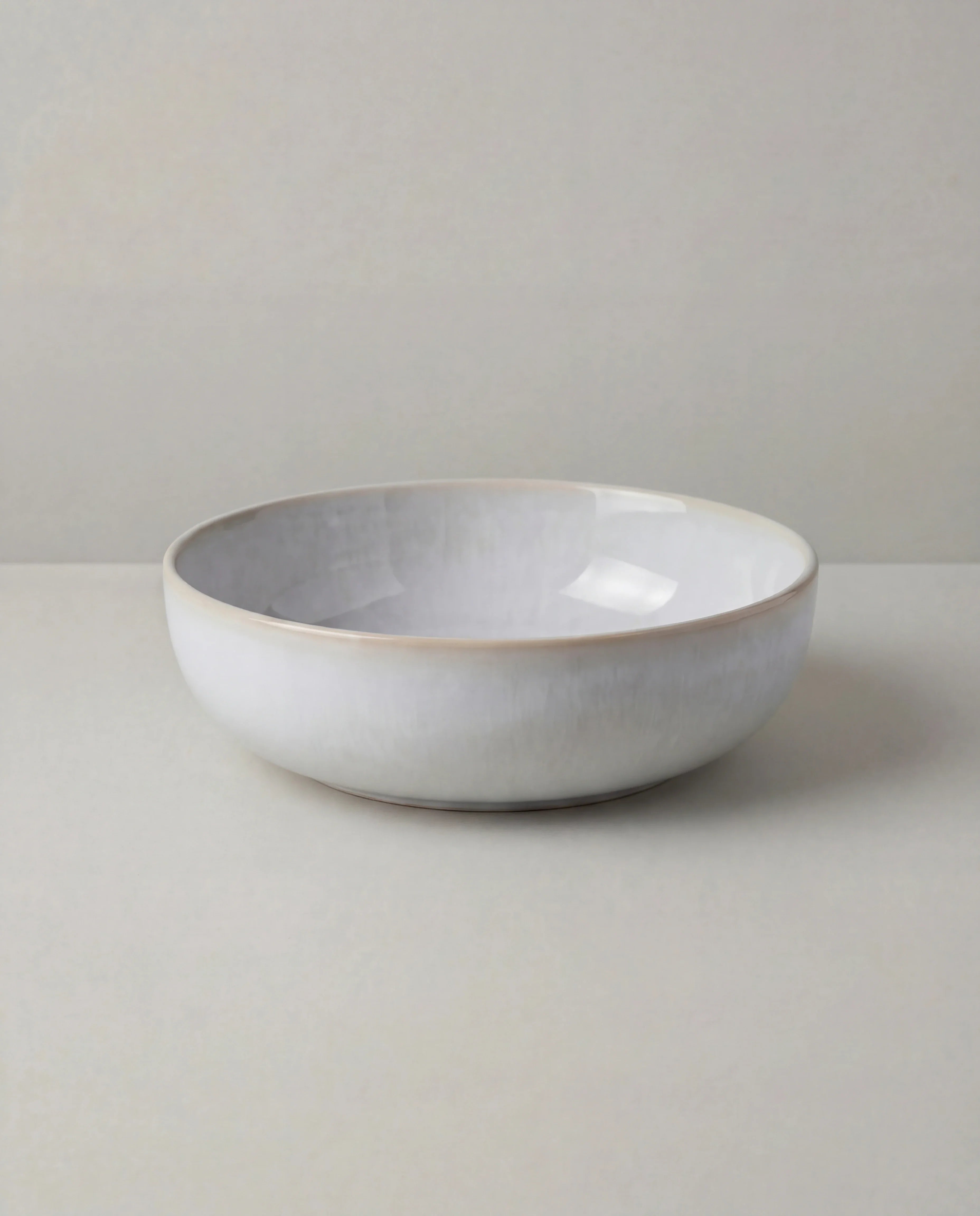 Lyra white ceramic dish set with a bowl resting on a matching plate