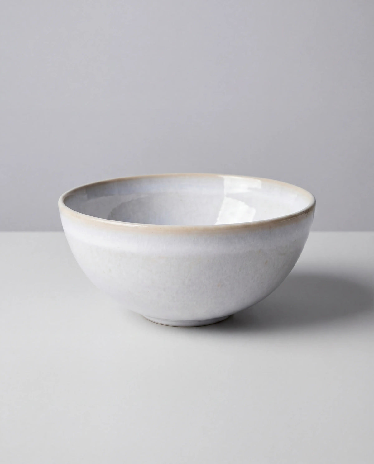 Lyra white ceramic bowl with a subtle beige rim from the 32+1 piece dish set