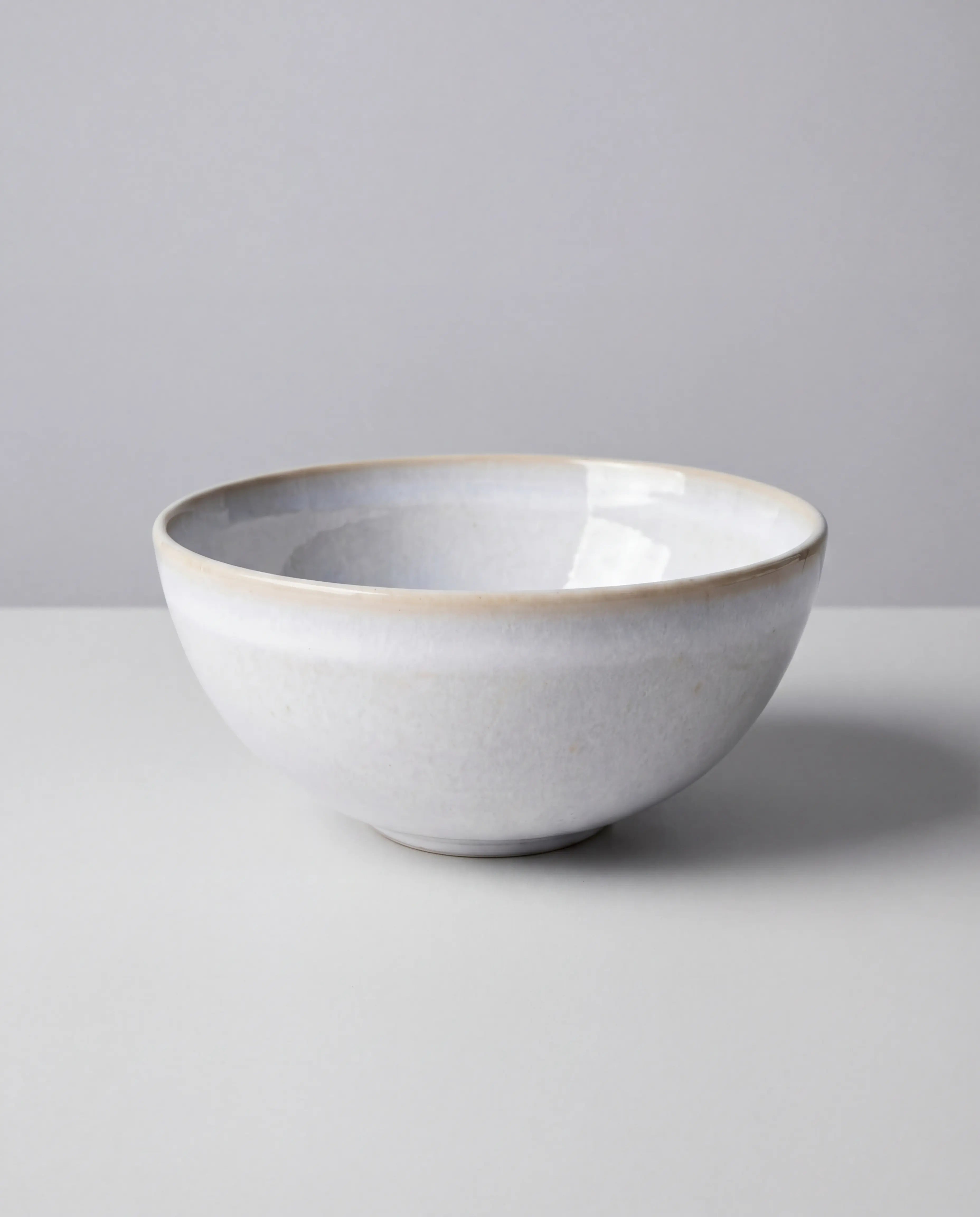 Lyra white ceramic bowl with a subtle beige rim from the 32+1 piece dish set