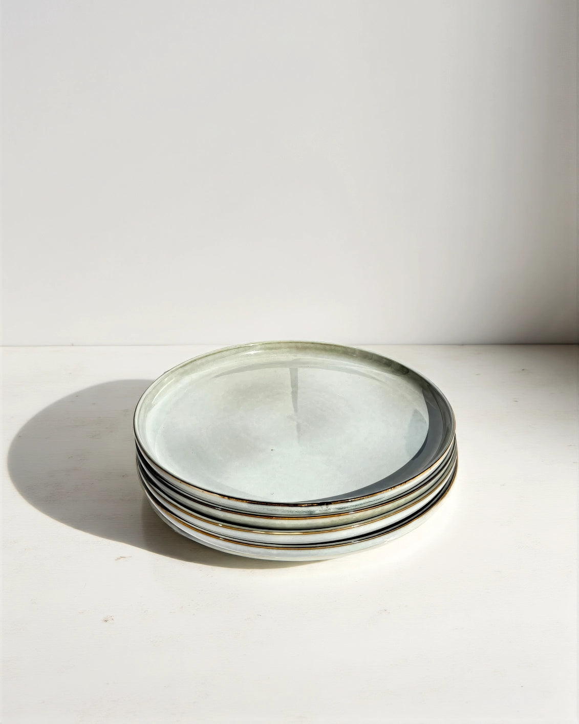 Stack of six Nordic Forest gray dinner plates with dark rims