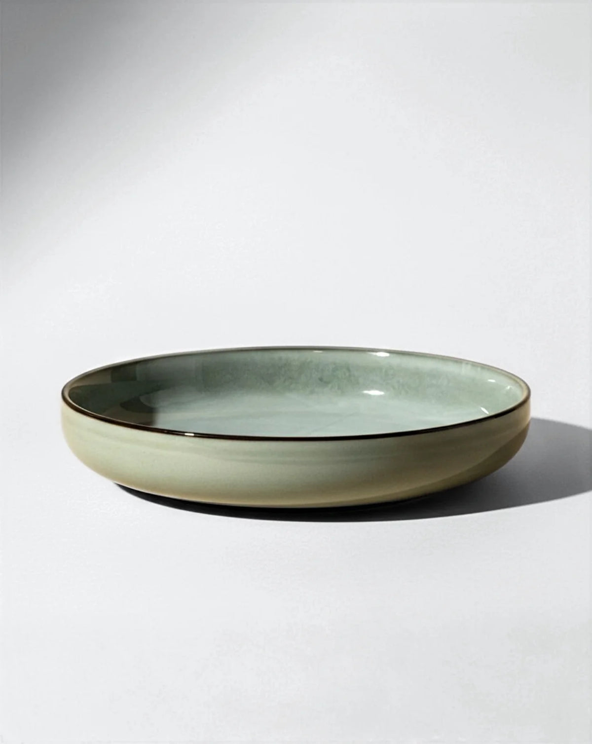 Green glazed Nordic Forest shallow bowl from the Scandic Soul 48 piece dinnerware set