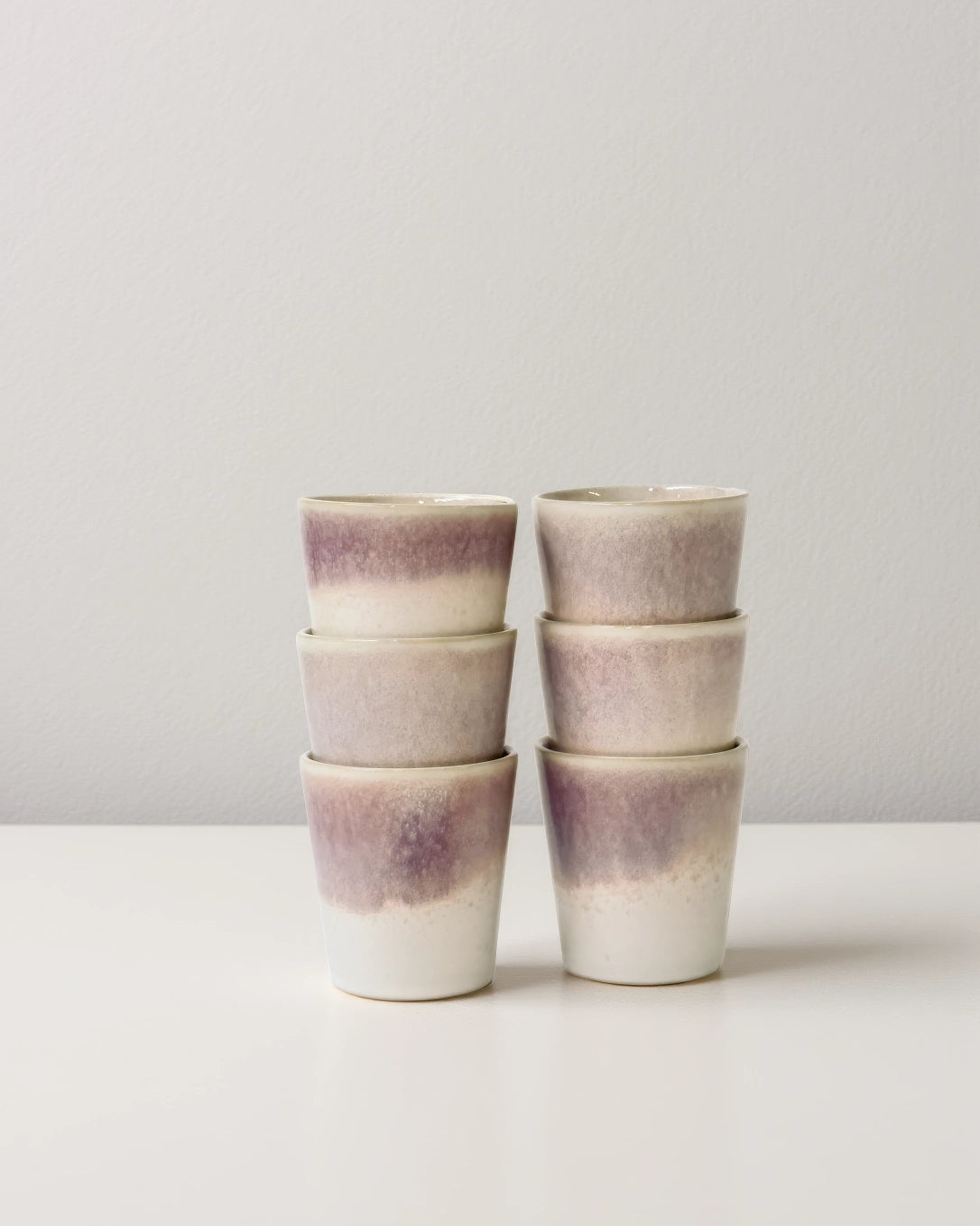 Six Becher Varadero cups stacked into two columns with a purple gradient glaze